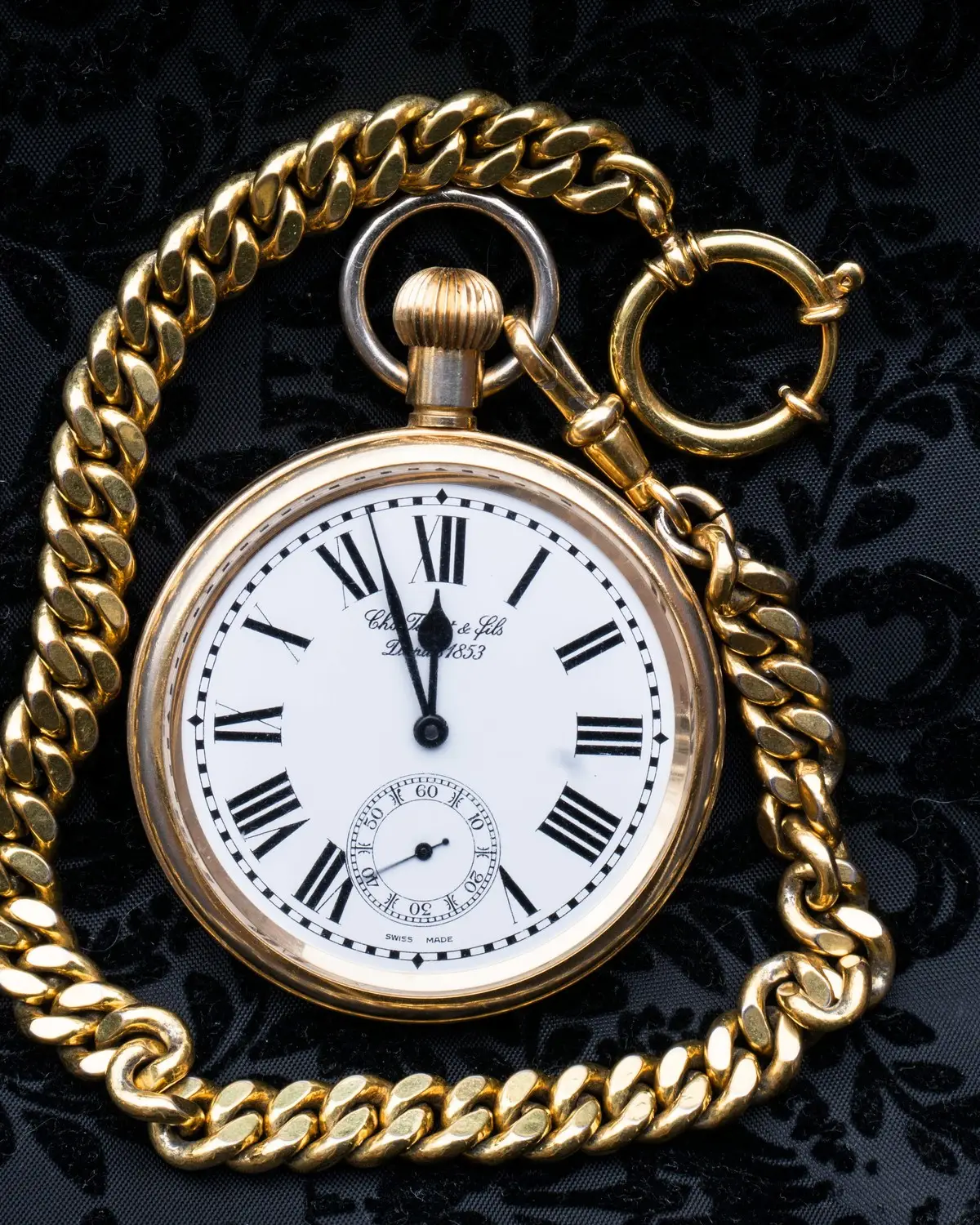 Vintage gold pocket watch on a chain